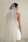 A model wearing STELLA II, a two tier wedding veil with crystals by Madame Tulle