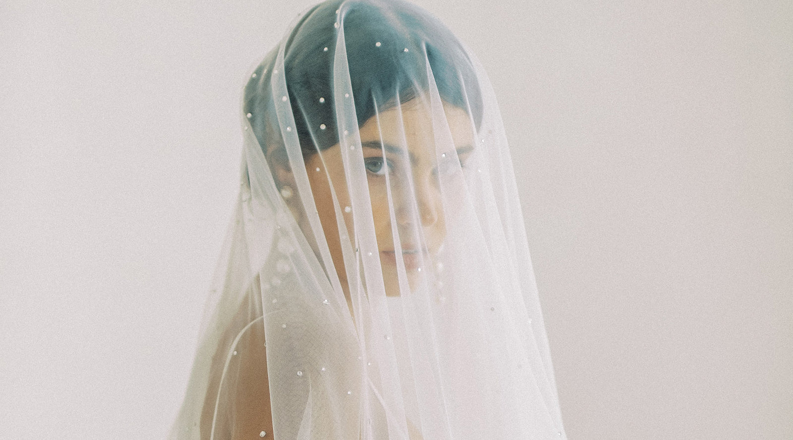 Beautiful_Bride_Putting_On_Earrings