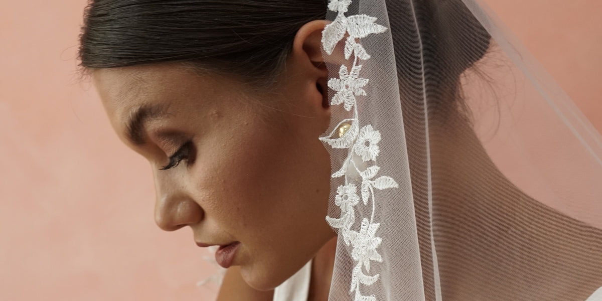 model wears one tier embroidered wedding veil 