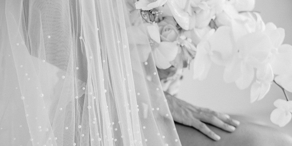 model wears a two tier pearl wedding veil