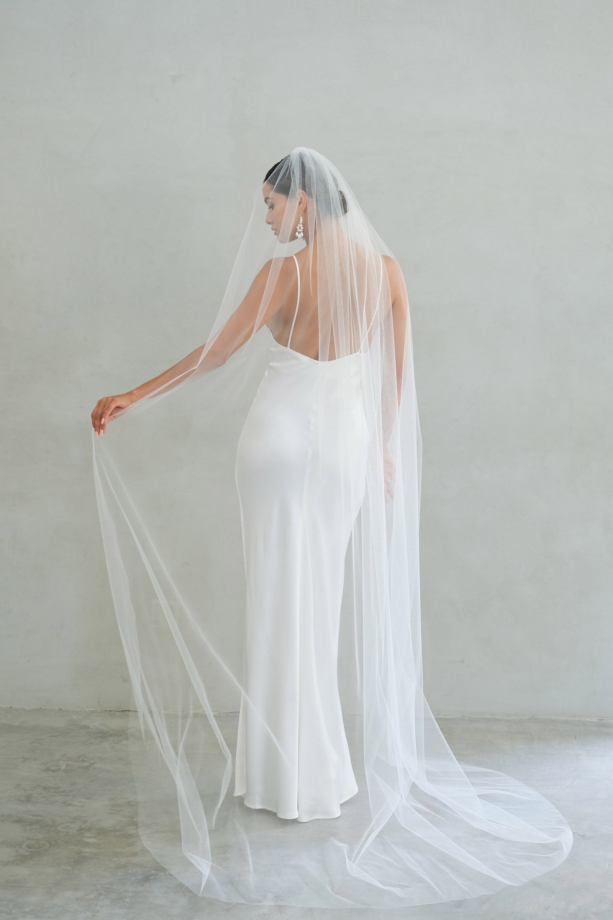 A model wearing the Alexa I one tier wedding veil by Madame Tulle bridal Sydney