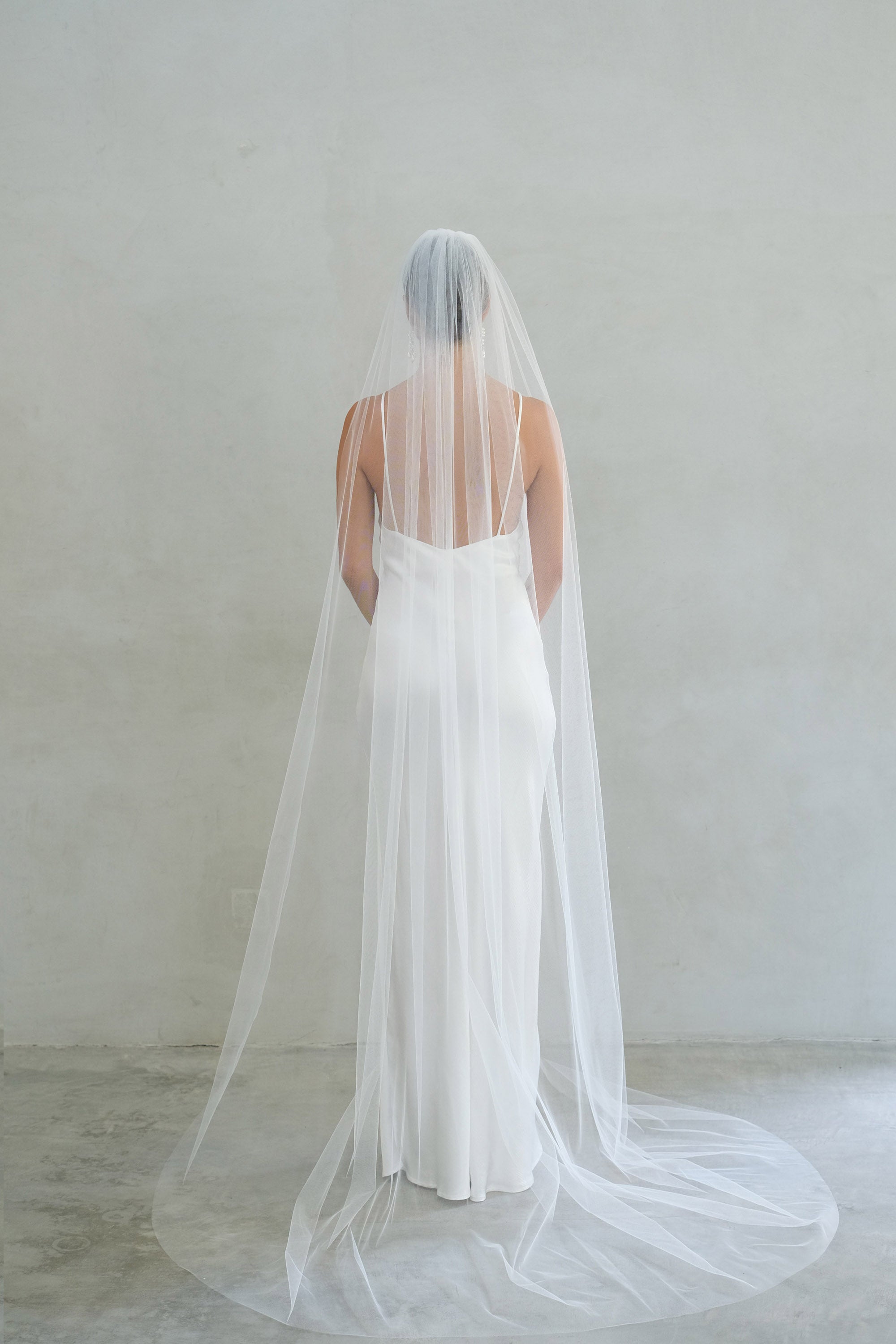 A model wearing the Alexa I one tier wedding veil by Madame Tulle bridal Sydney