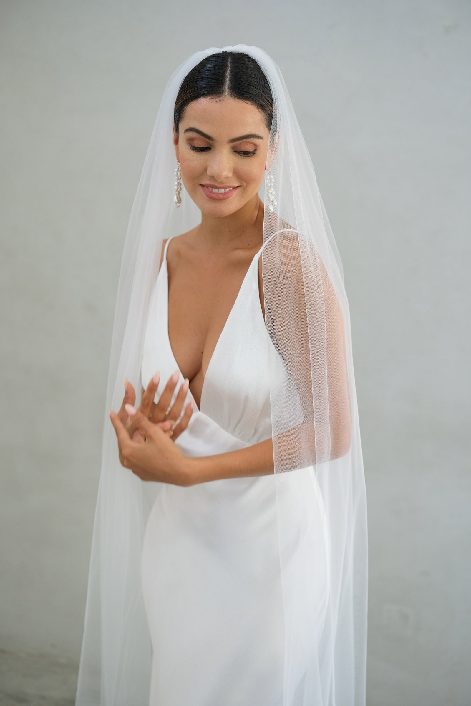 A model wearing the Alexa I one tier wedding veil by Madame Tulle bridal Sydney