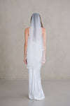 Model wears a wedding veil, drop veil with pearls and sequins
