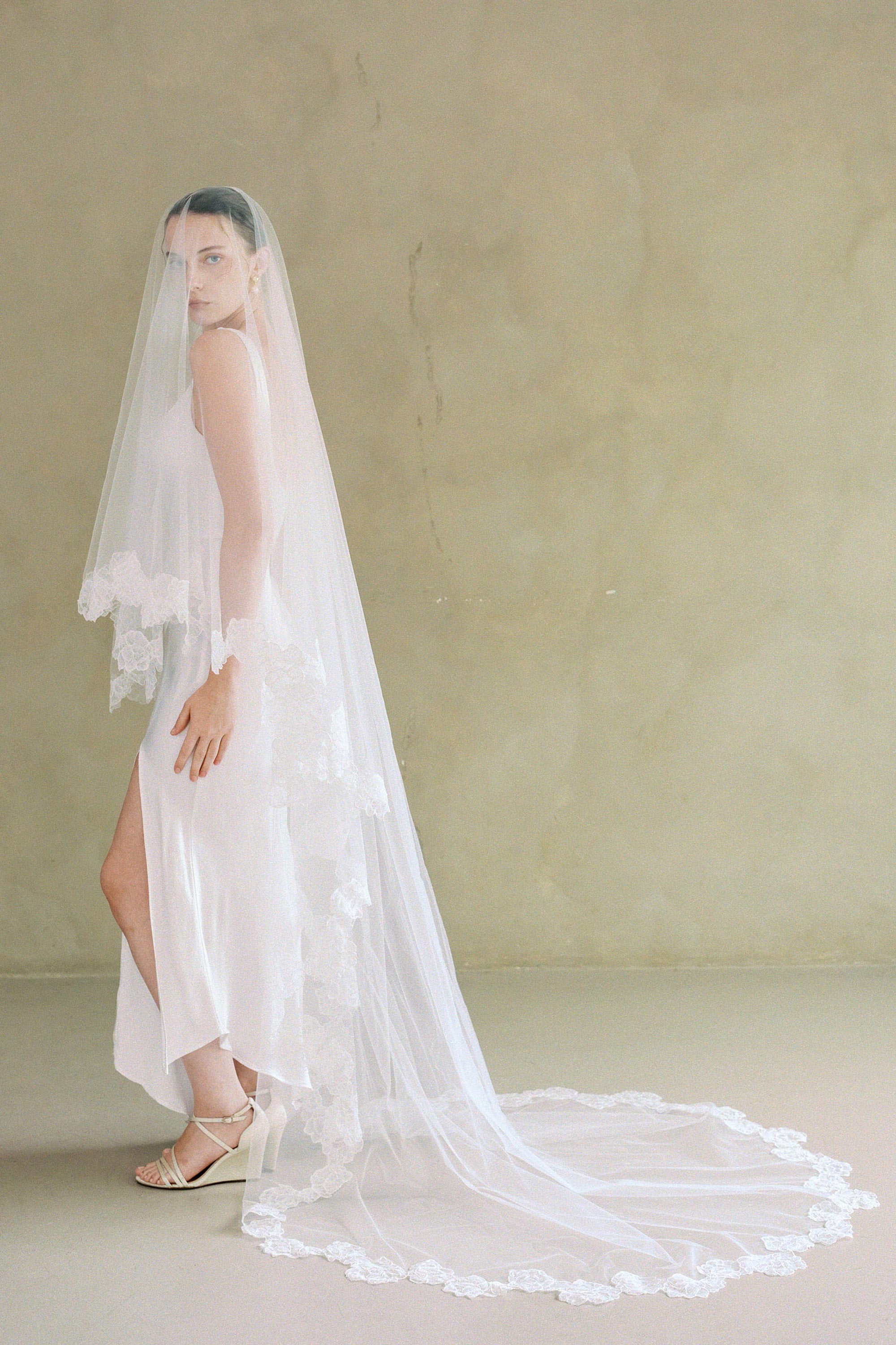 model wears two-tier lace trim wedding veil