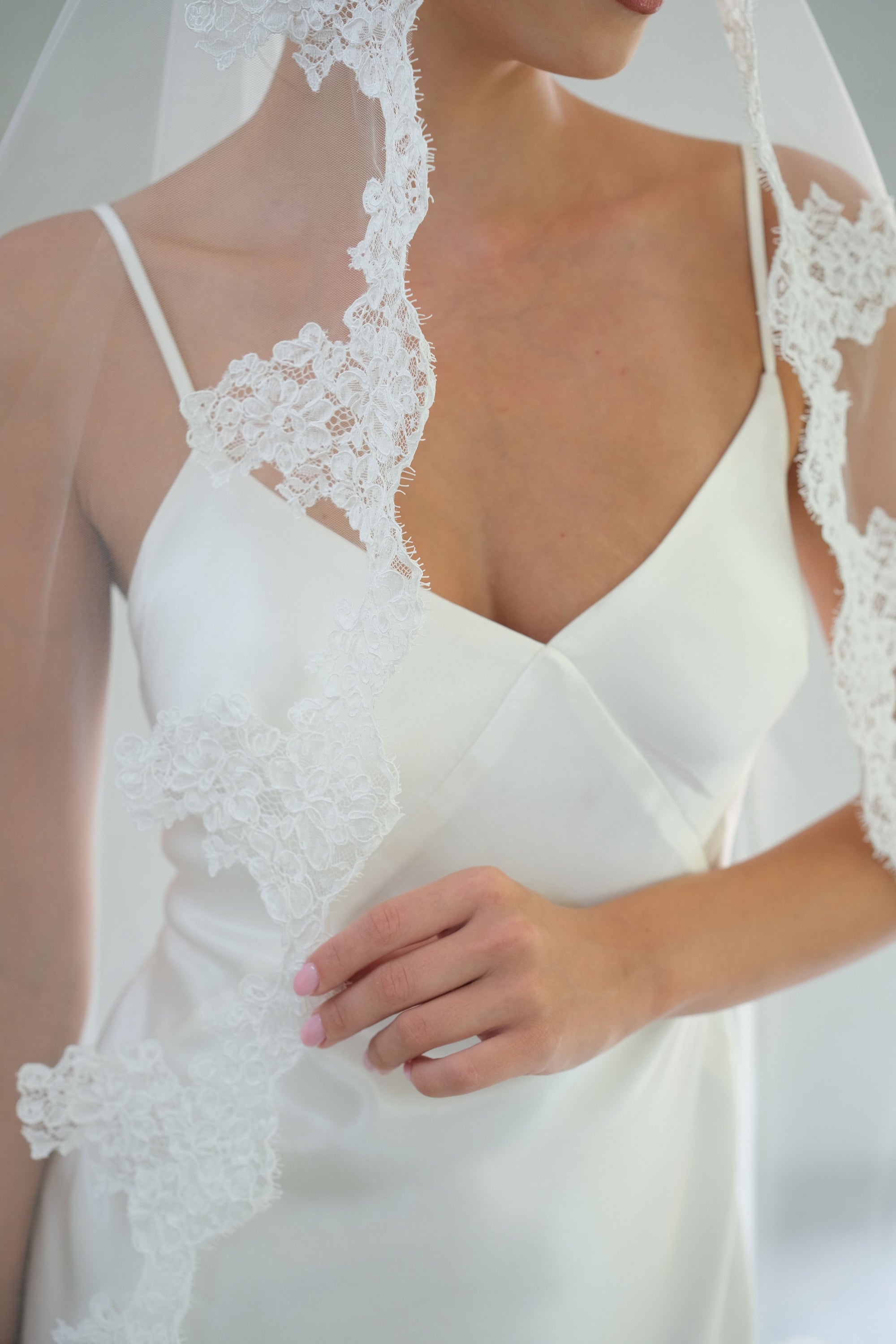 Detail of lace trim on mantilla bridal veil