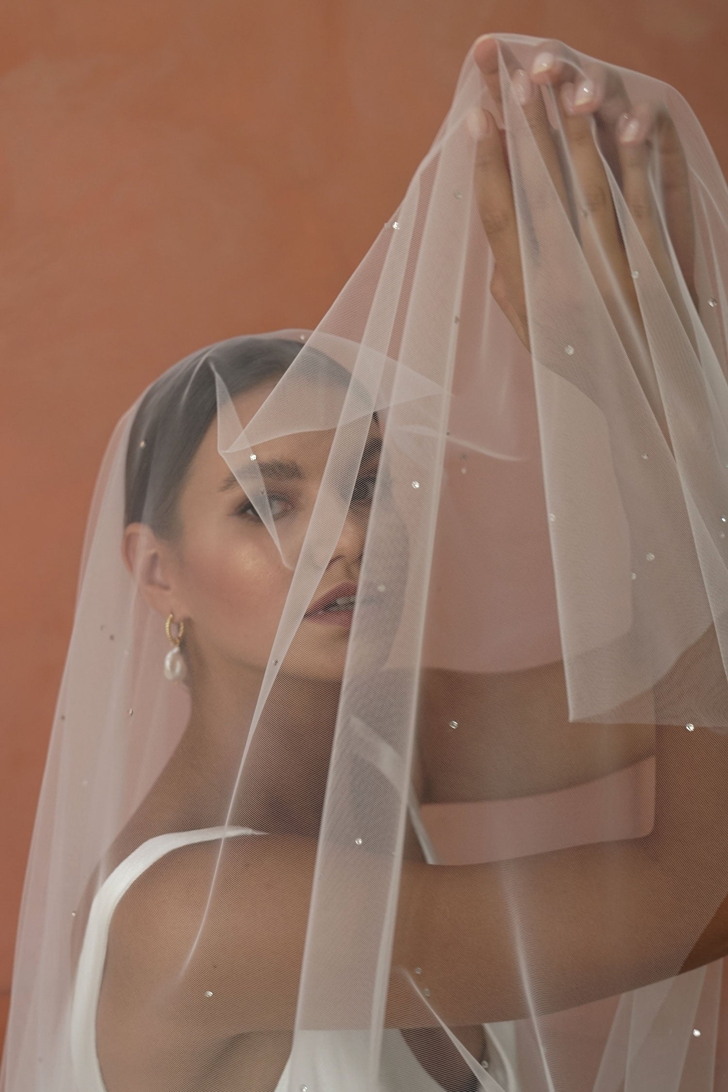 model wears drop veil with crystals,  two-tier wedding veil with crystal
