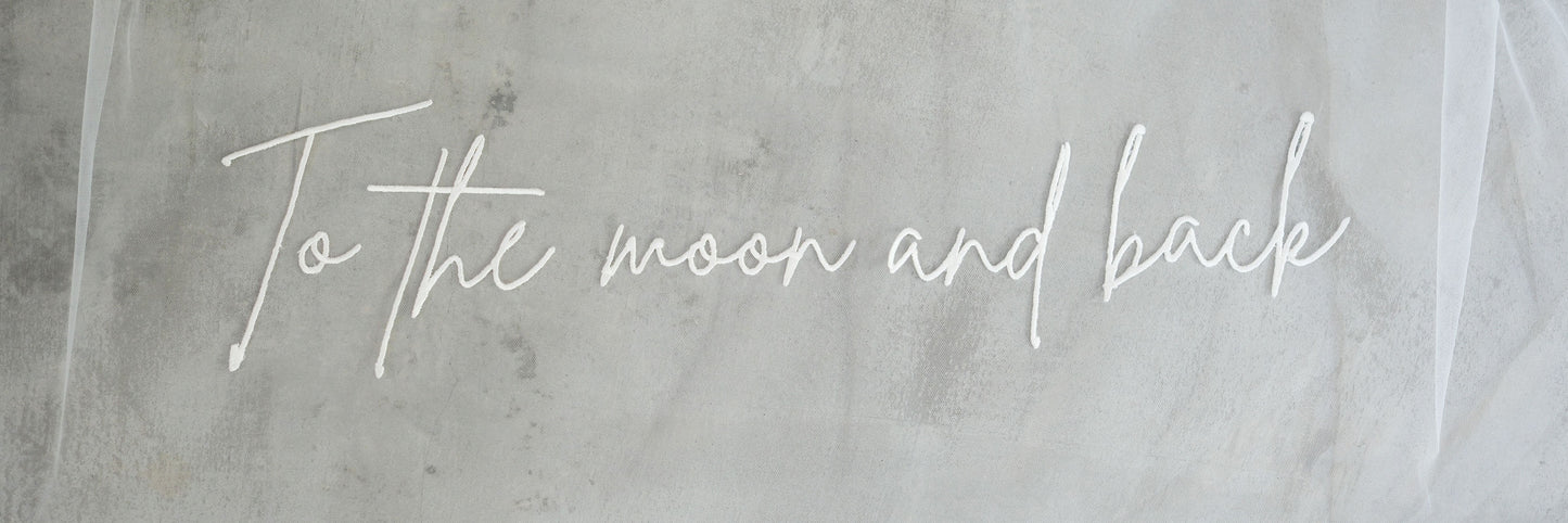 Romantic message is embroidered on wedding veil