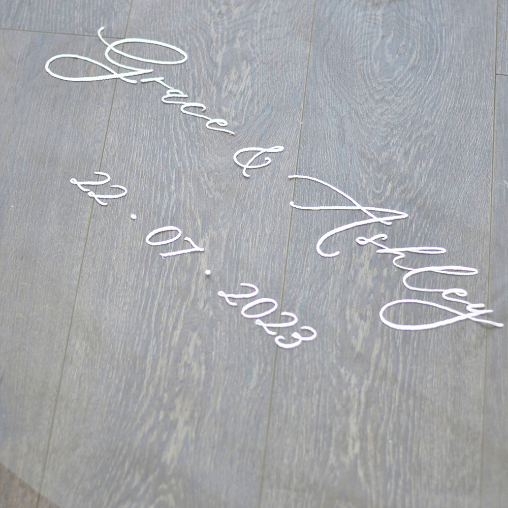 Bridal couple's names and wedding date embroidered on train on wedding veil personalised by Madame Tulle Sydney