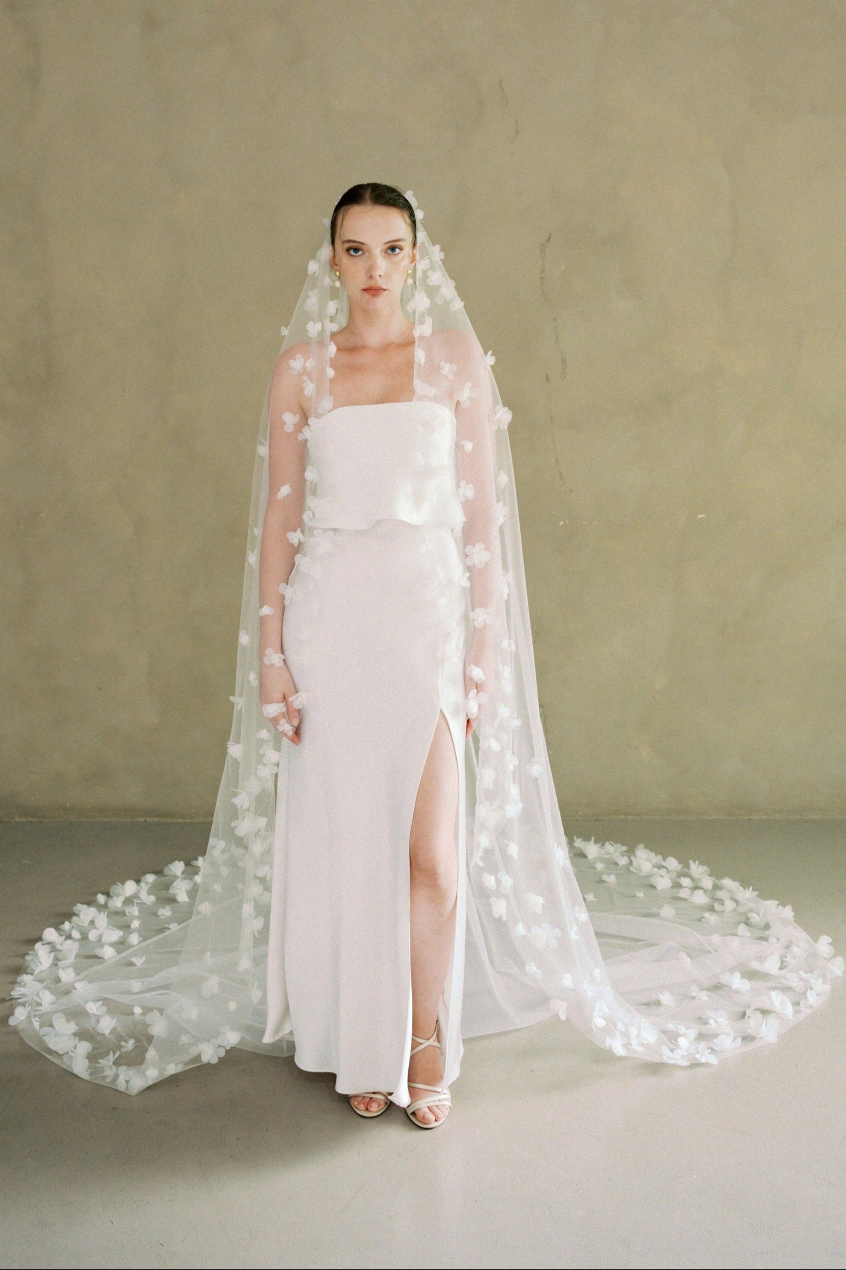Model wears a 3D floral wedding veils made by Madame Tulle bridal