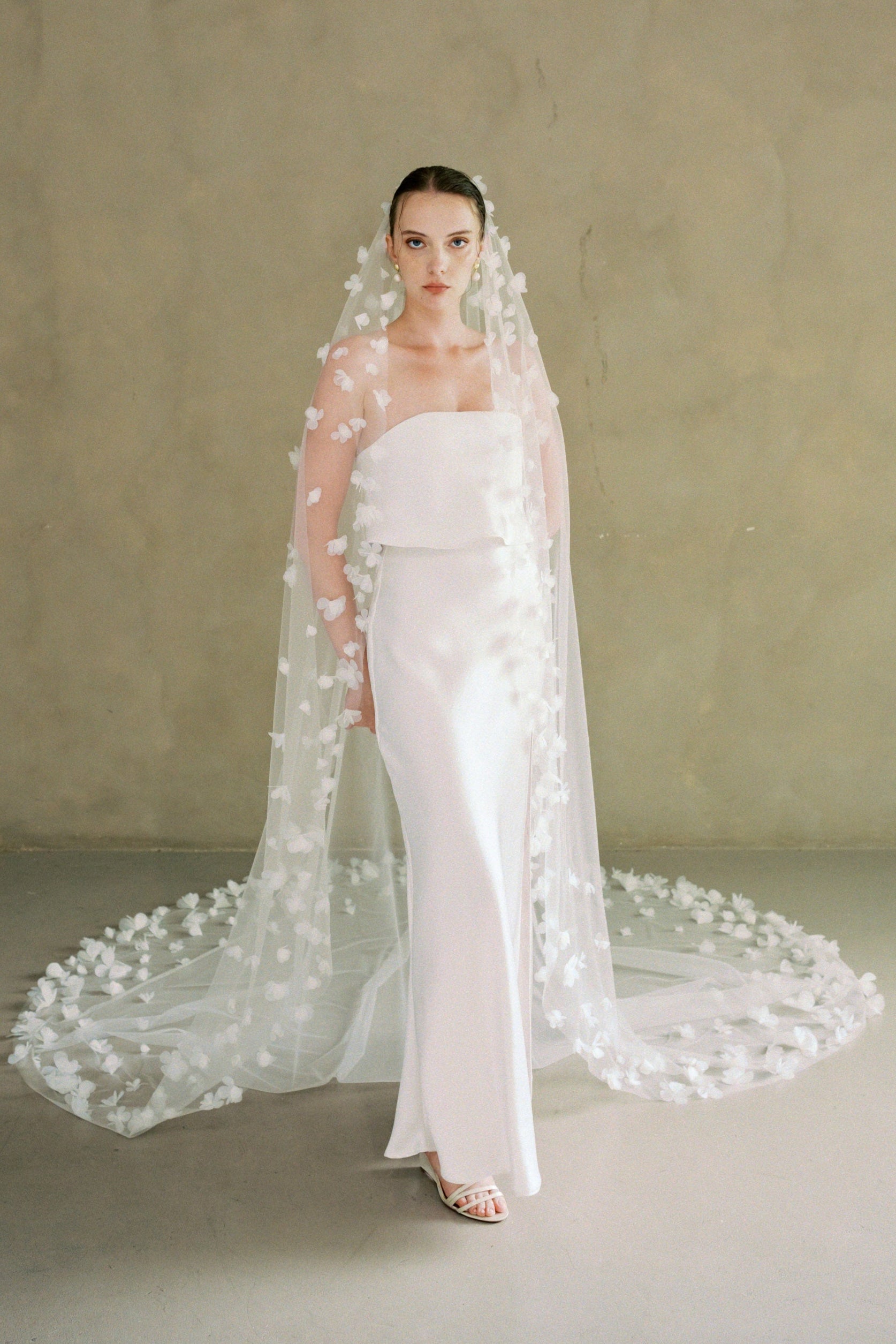 Model wears a 3D floral wedding veil made by Madame Tulle bridal