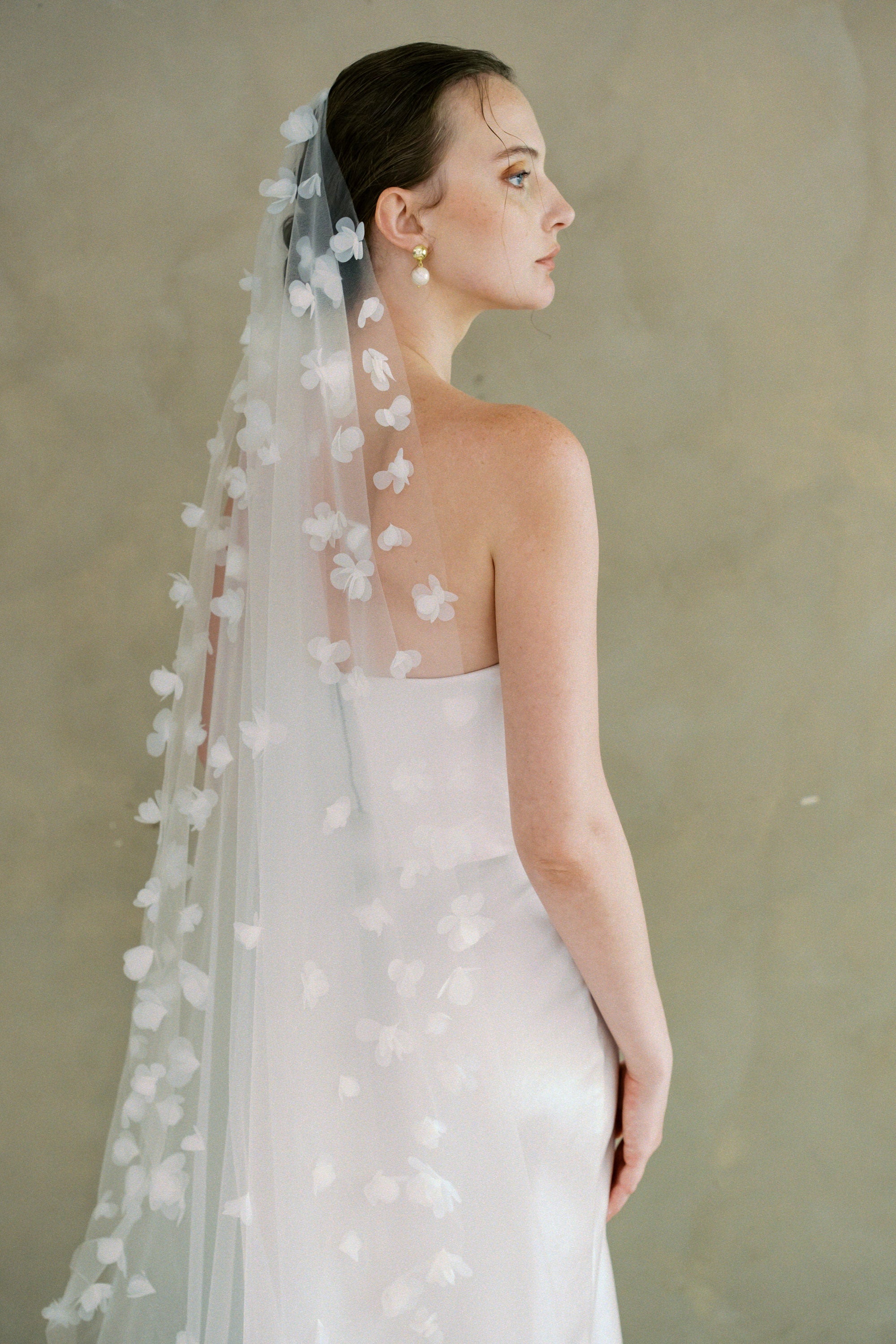 Model wears a 3D floral wedding veils made by Madame Tulle bridal