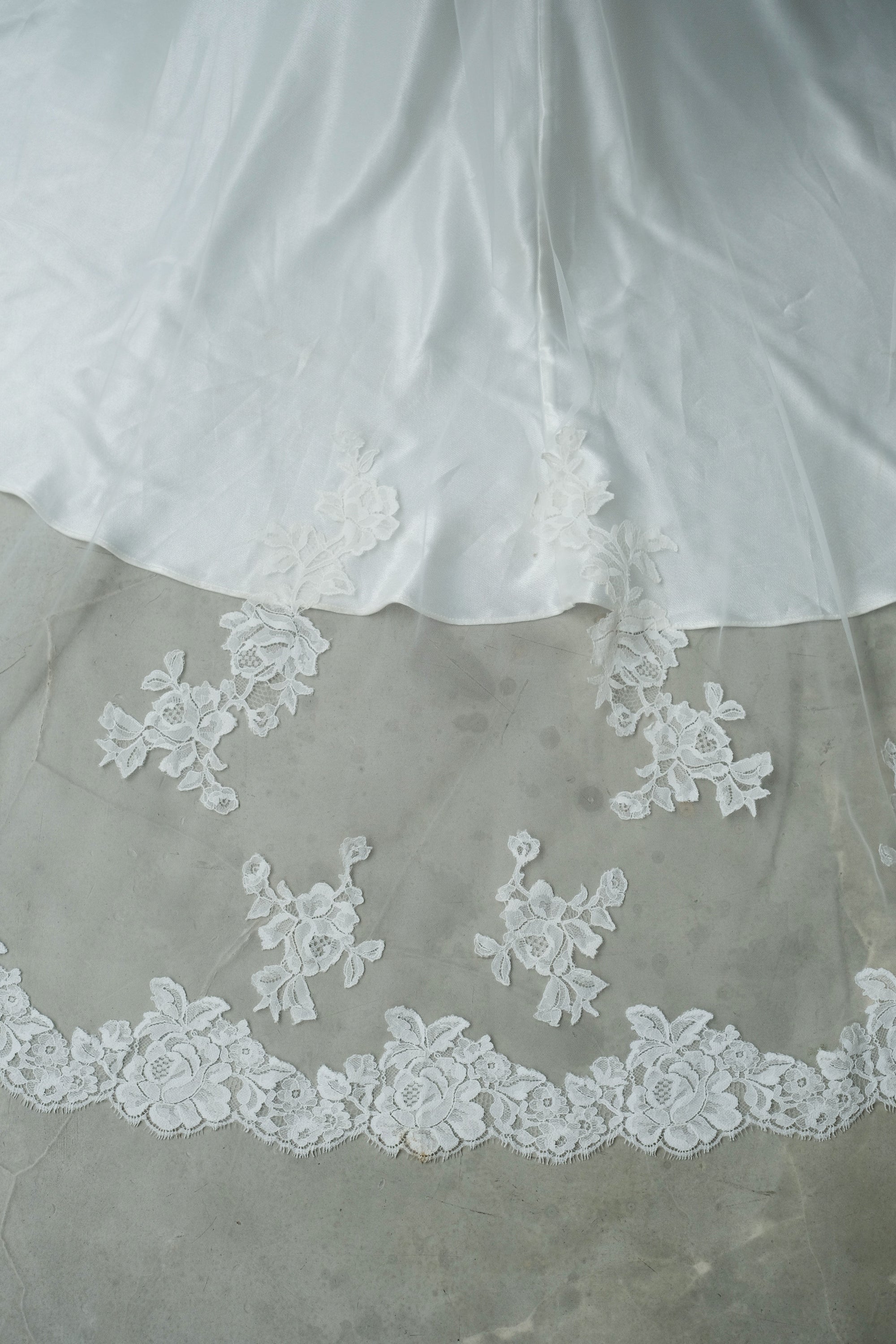 Close up details of lace edge and lace appliques on a mantilla veil