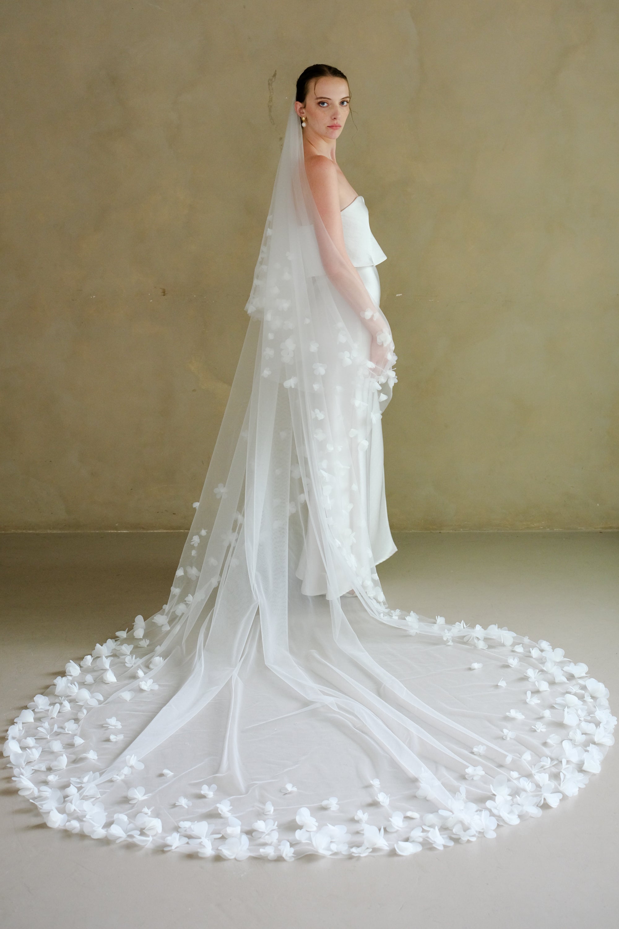 Model wearing a two tier floral wedding veil made by Madame Tulle Australia