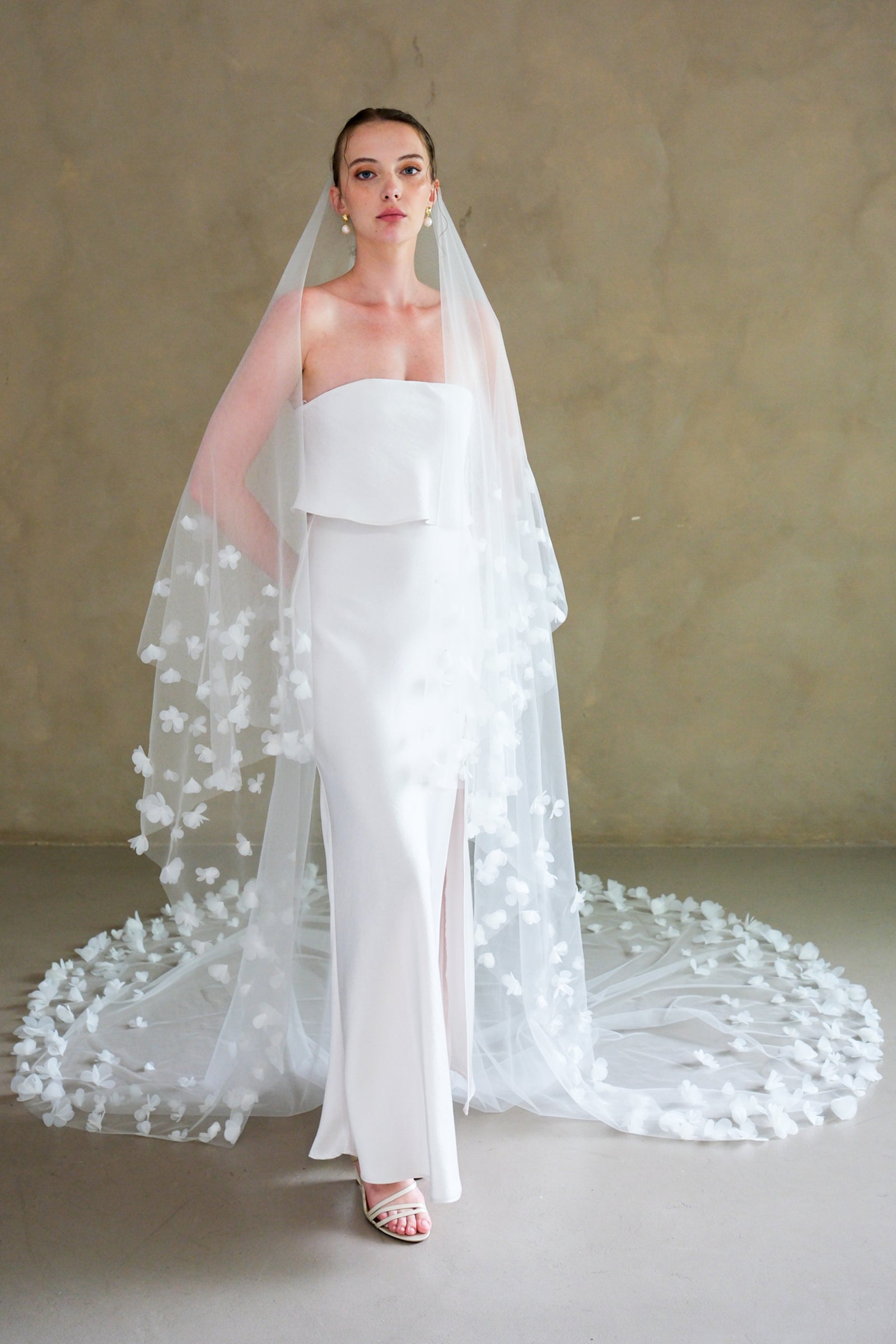 Model wearing a two tier floral wedding veil made by Madame Tulle Australia