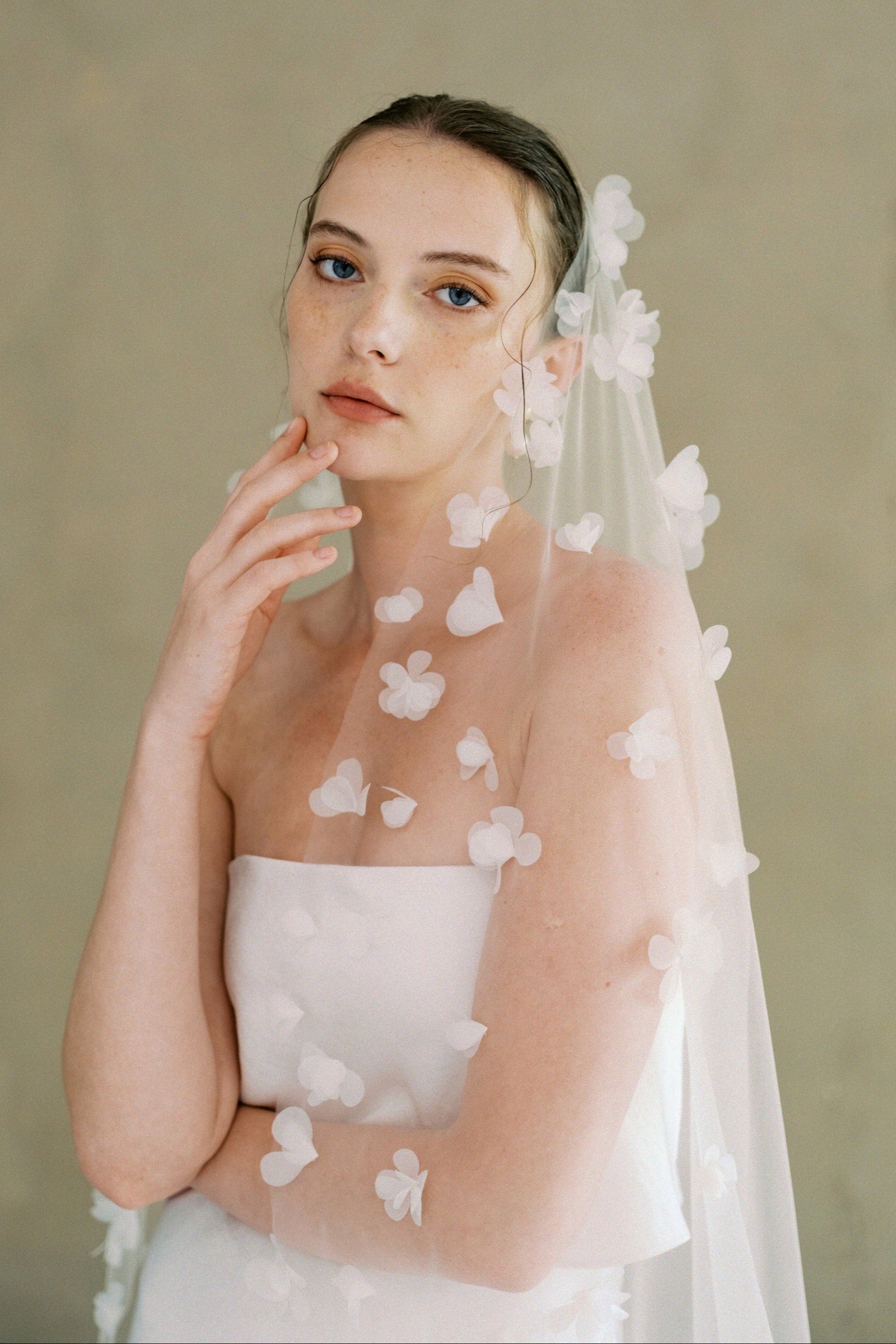 Model wears a 3D floral wedding veils made by Madame Tulle bridal