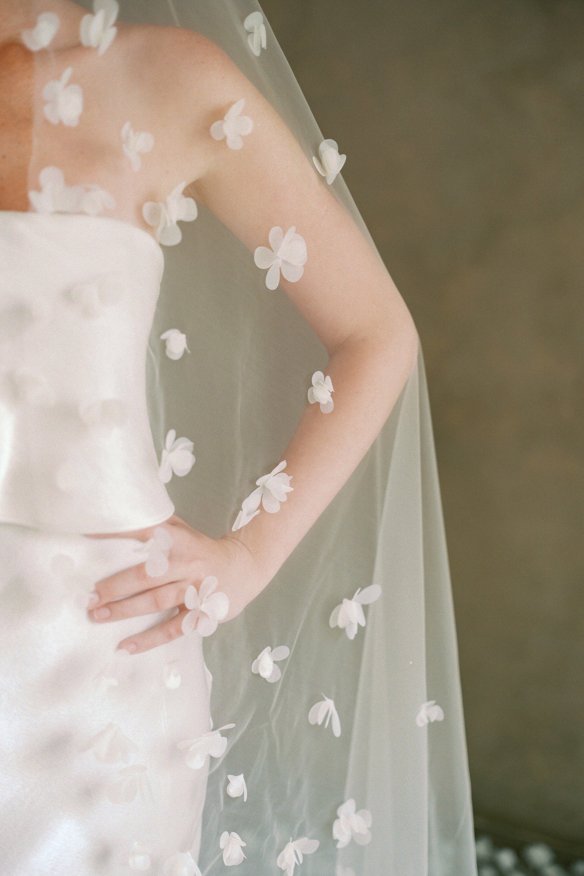 Model wears a 3D floral wedding veils made by Madame Tulle bridal