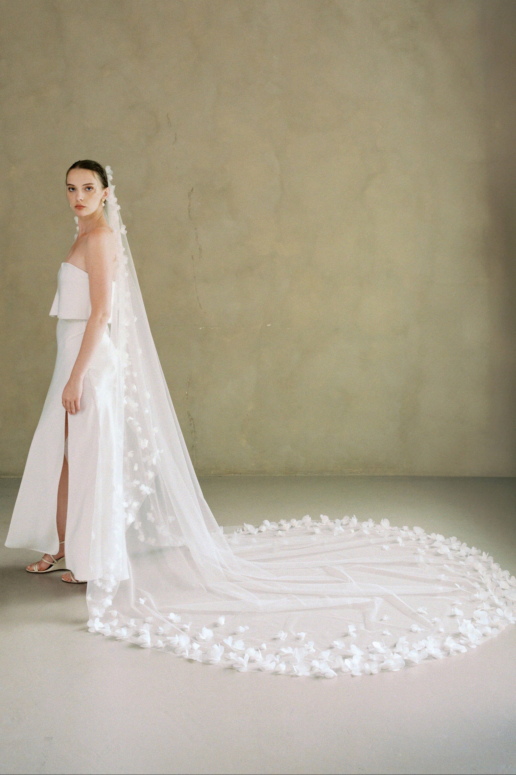 Model wears a 3D floral wedding veils made by Madame Tulle bridal