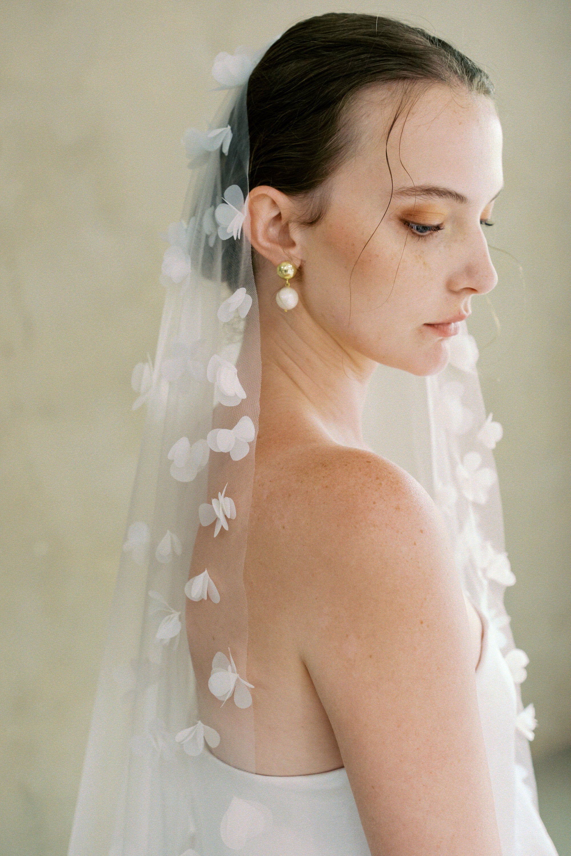 Model wears a 3D floral wedding veils made by Madame Tulle bridal