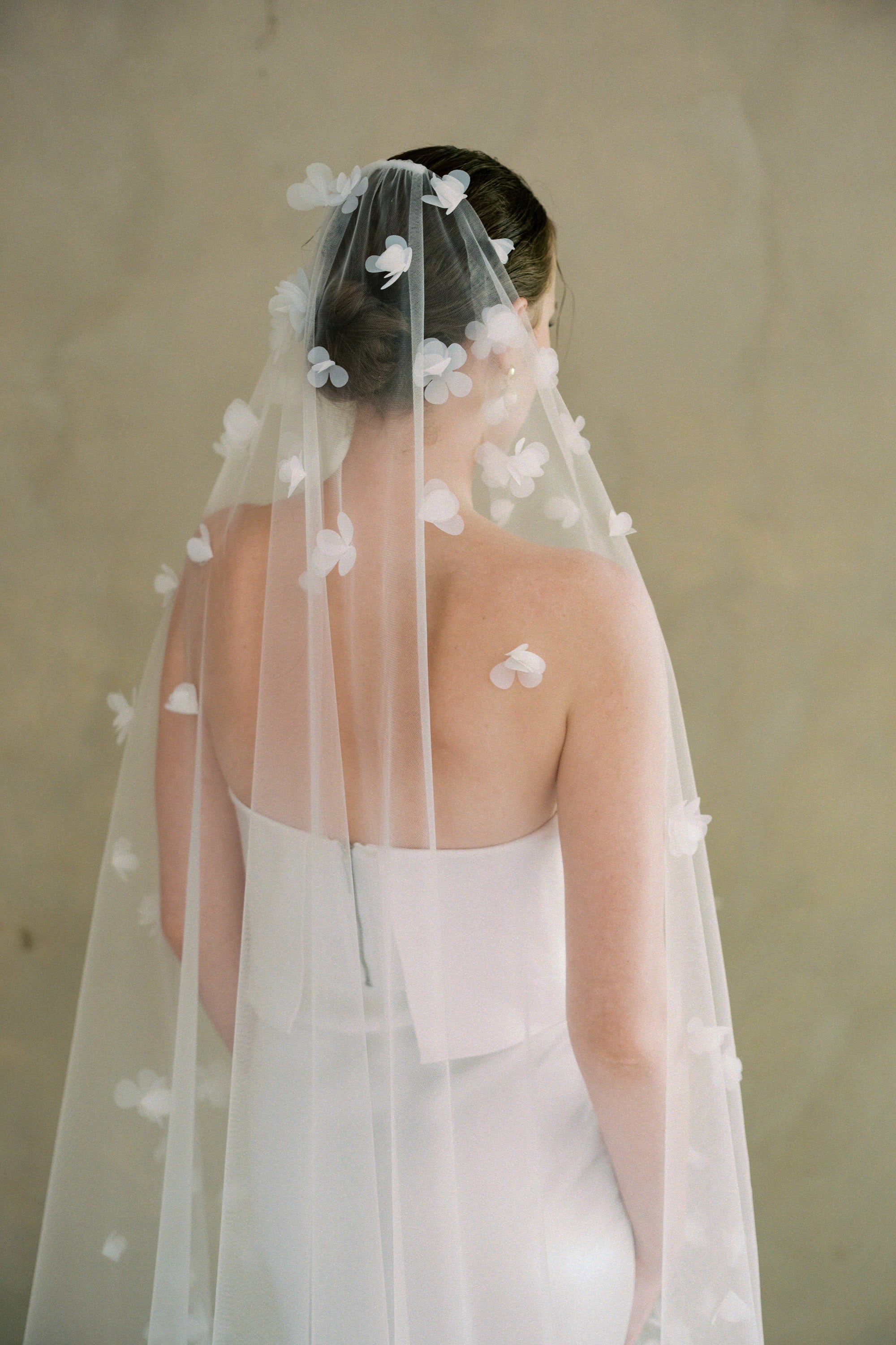 Model wears a 3D floral wedding veils made by Madame Tulle bridal