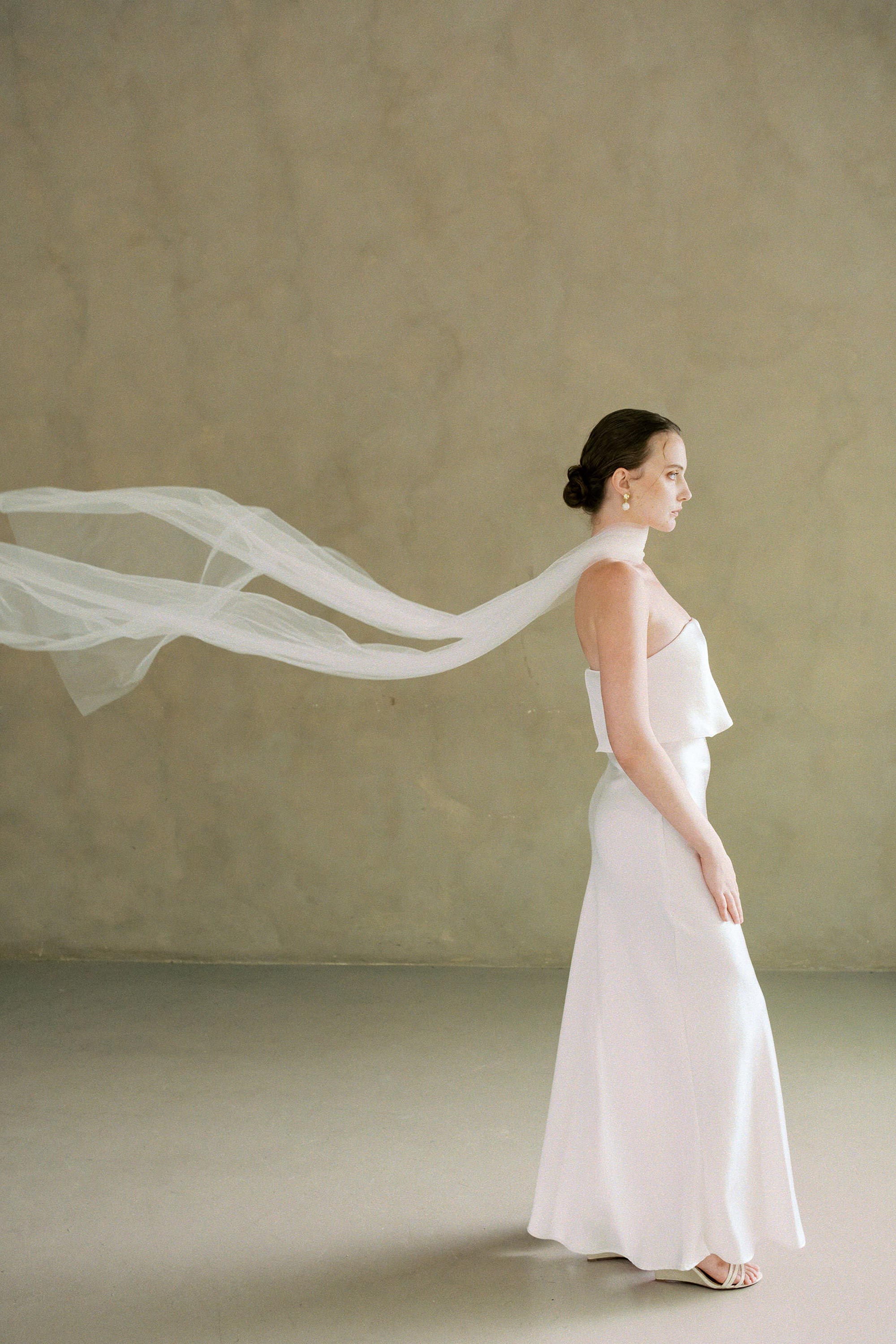 model wears soft tule wedding scarf 