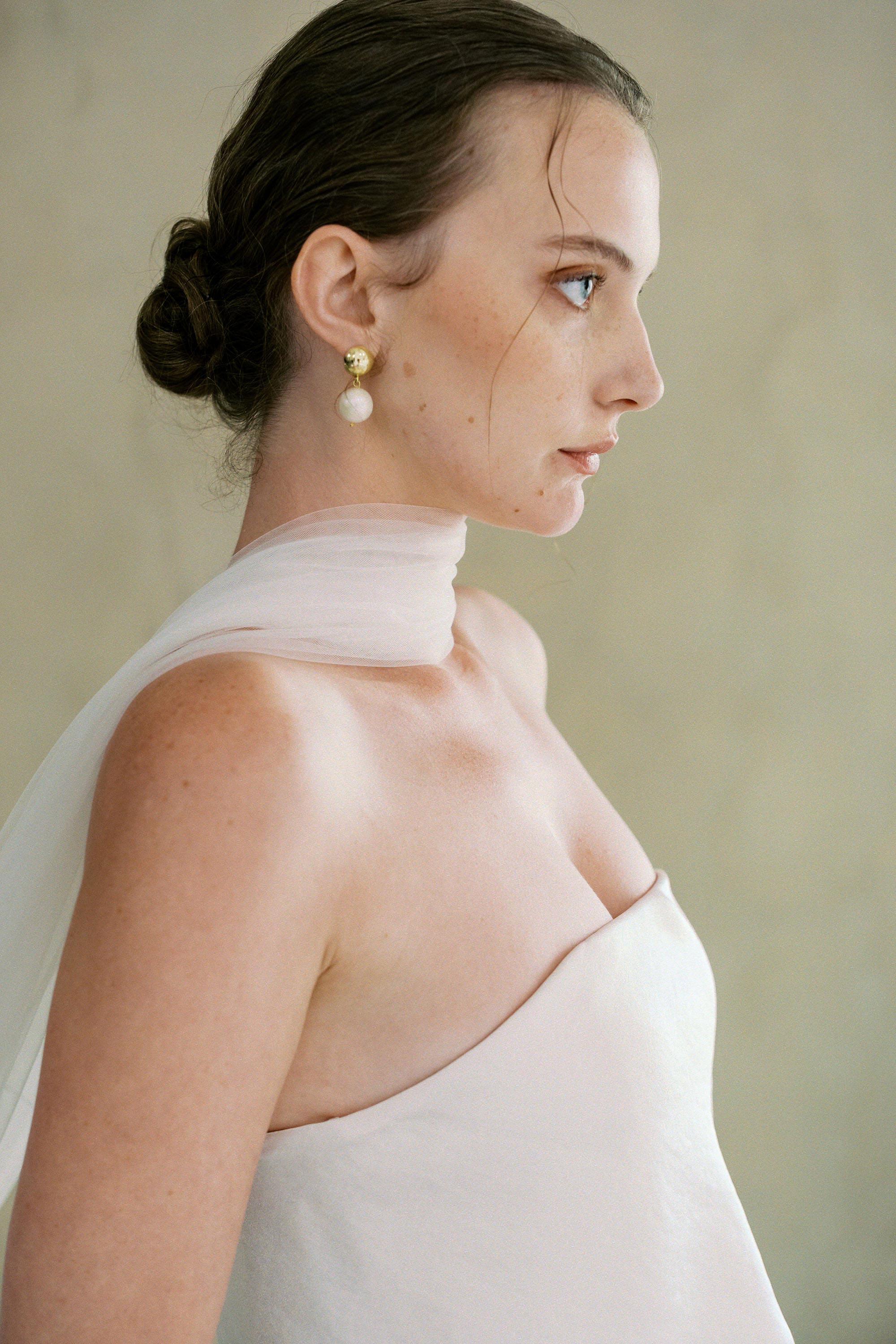 model wears soft tule wedding scarf 