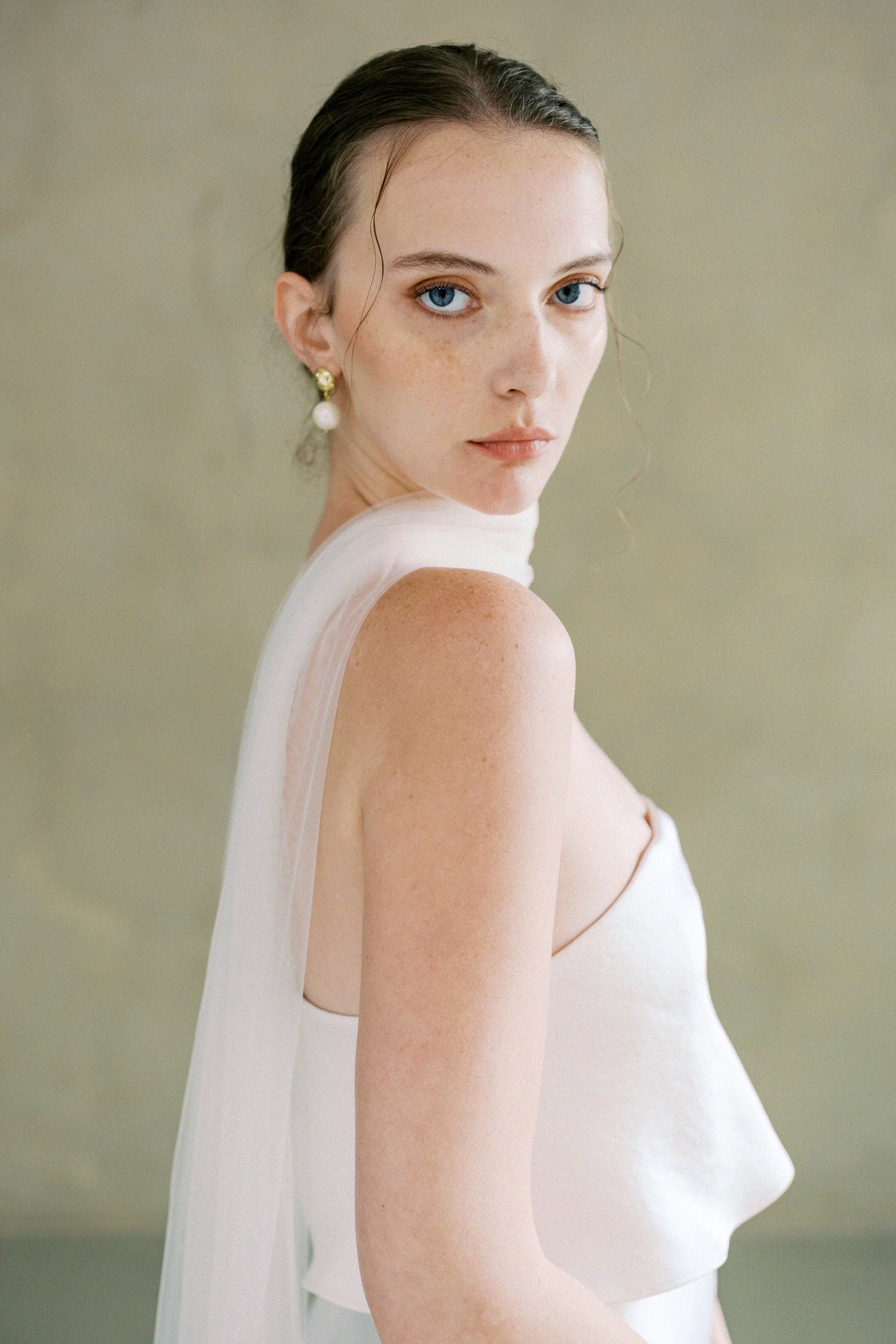 model wears soft tule wedding scarf 