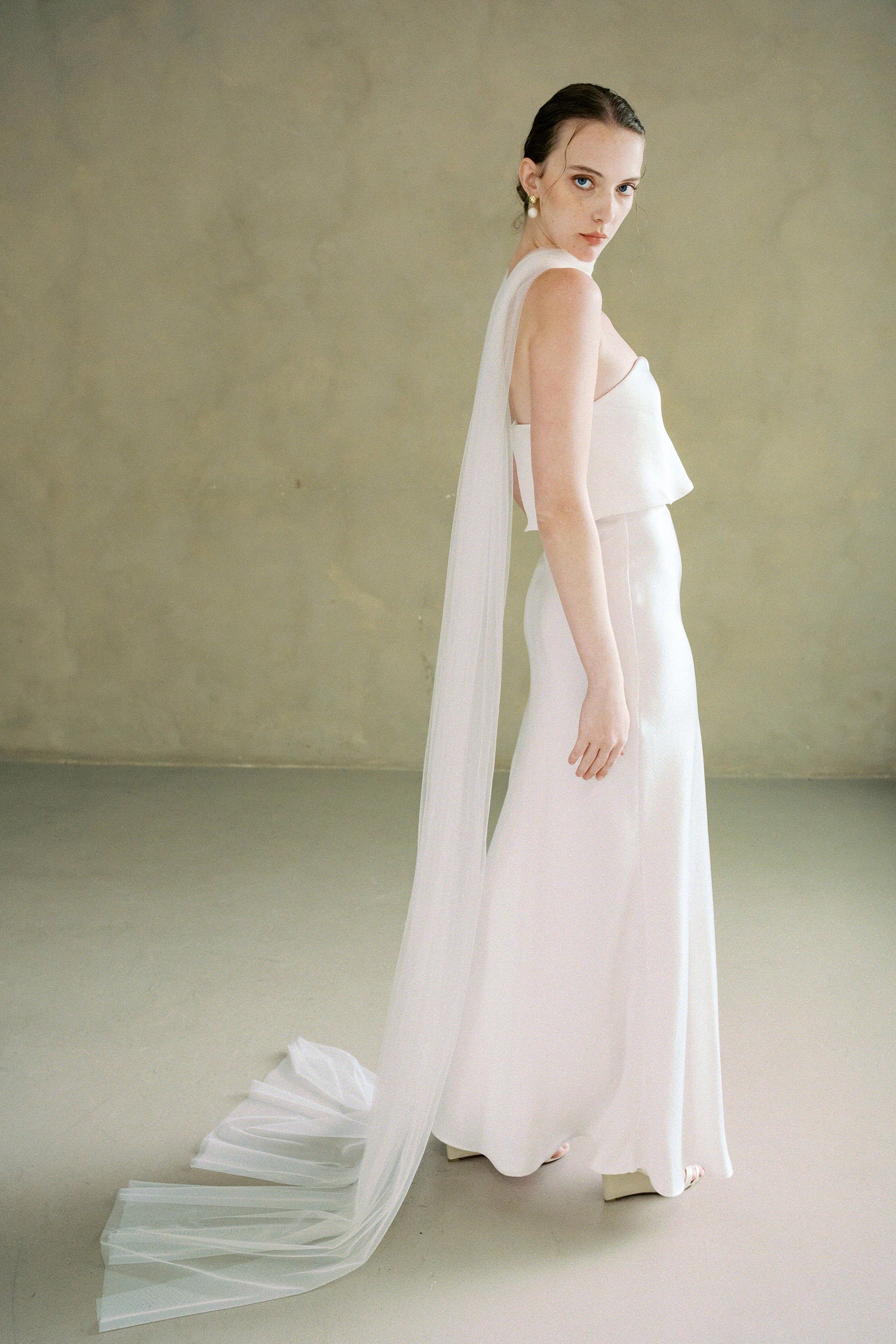 model wears soft tule wedding scarf 