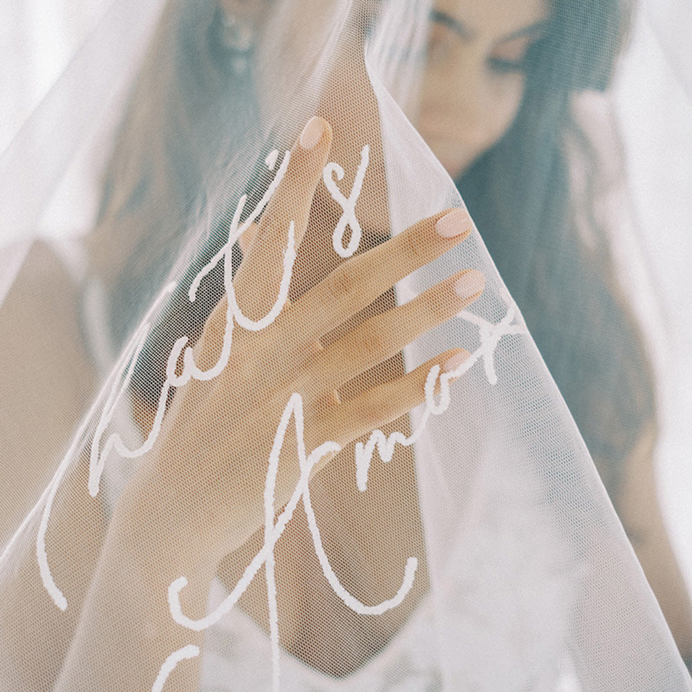Close up of custom embroidered romantic message on wedding veil