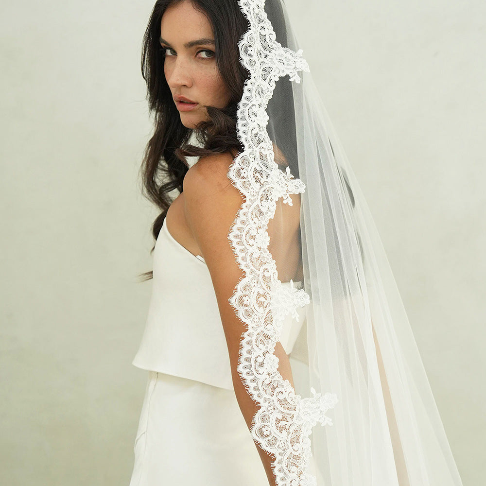 Bride models one tier mantilla veil trimmed with scalloped lace