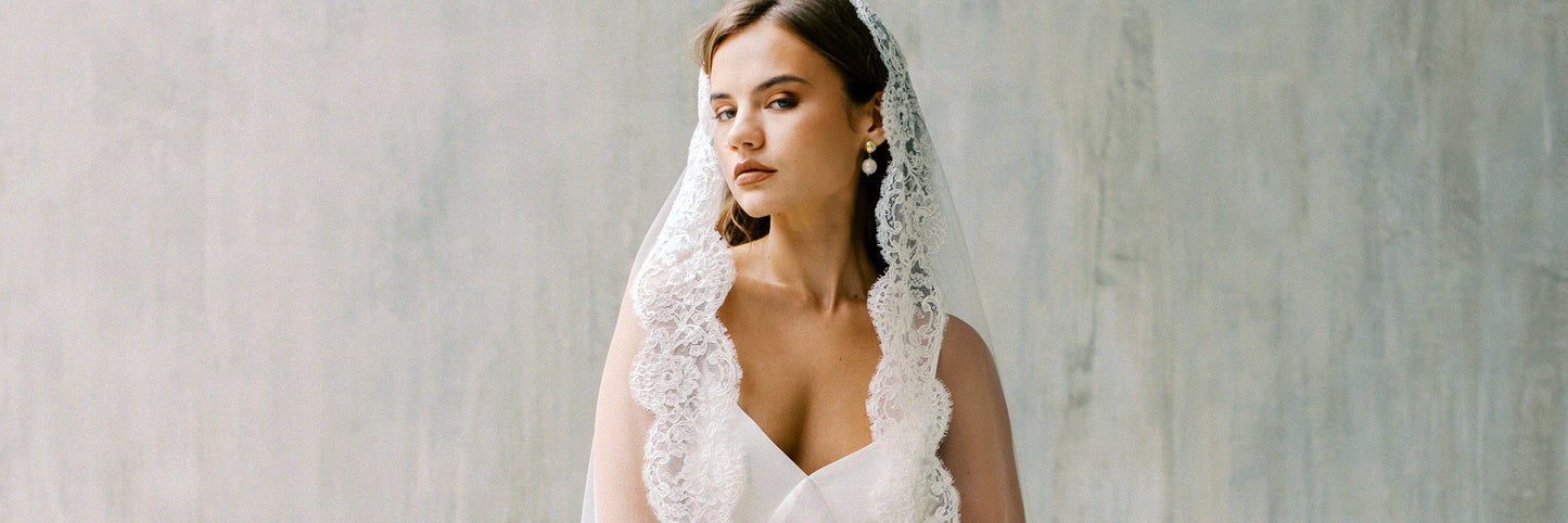 Corded lace trims a mantilla style wedding veil by Madae Tulle Sydney