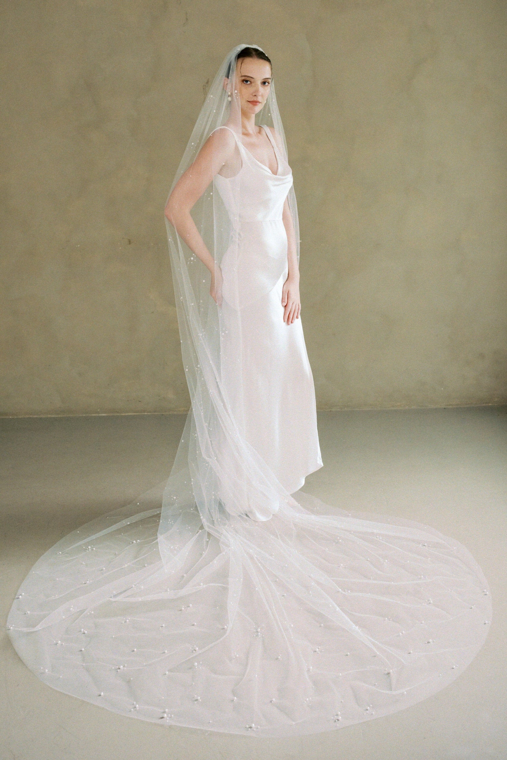 model wears a one-tier pearl wedding veil made by Madame Tulle bridal