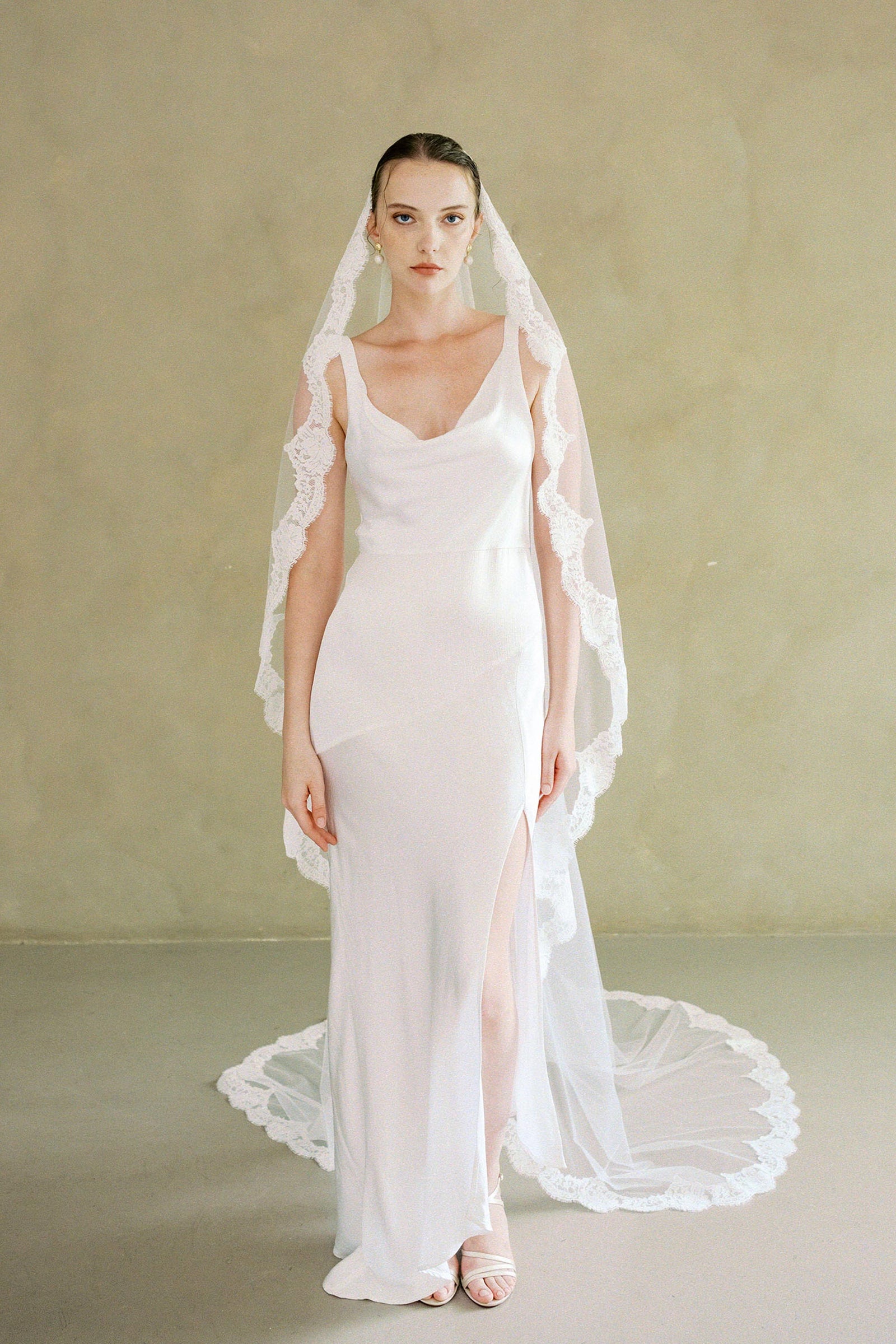 model wears one-tier lace Mantilla veil