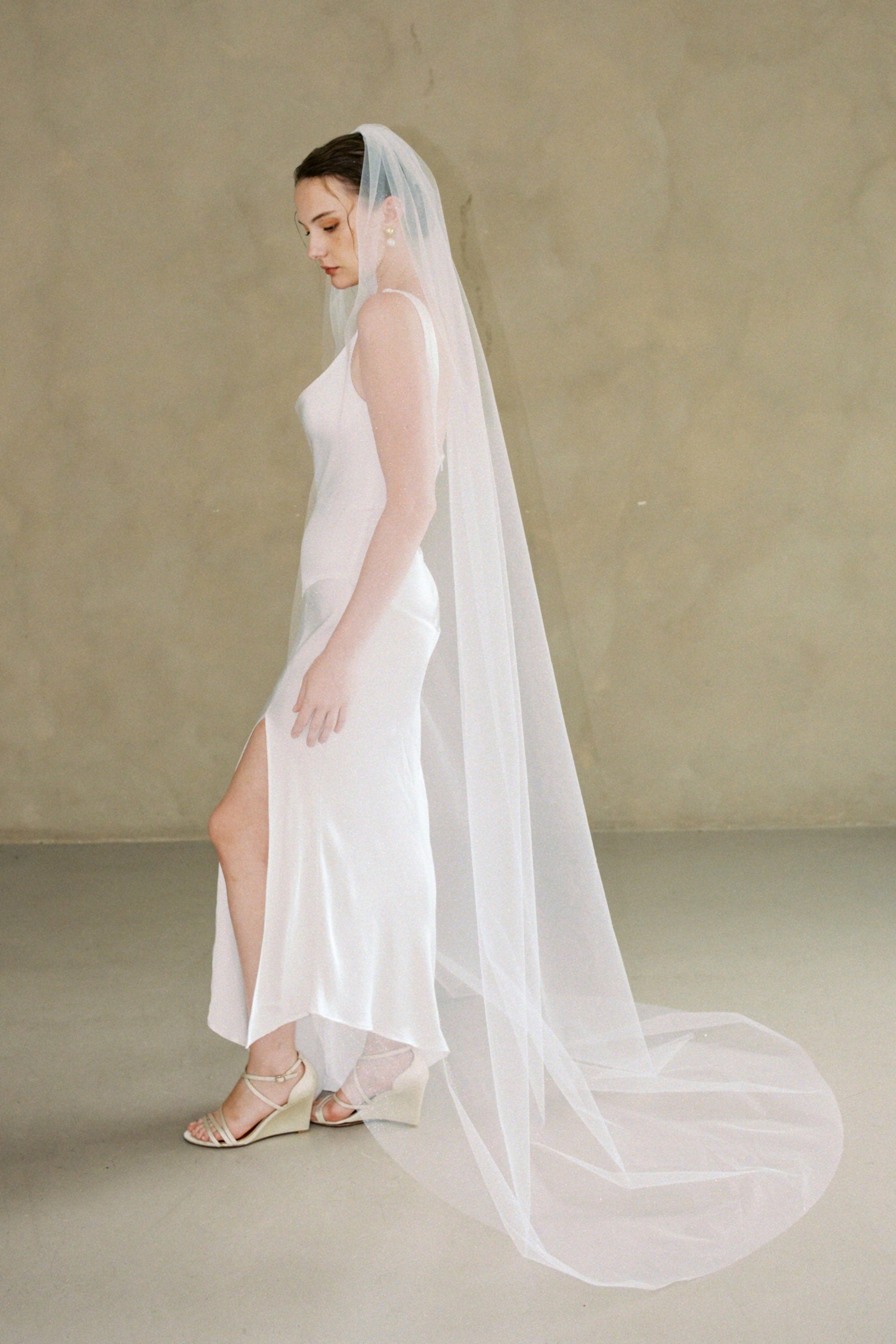 model wears a one-tier glitter veil 