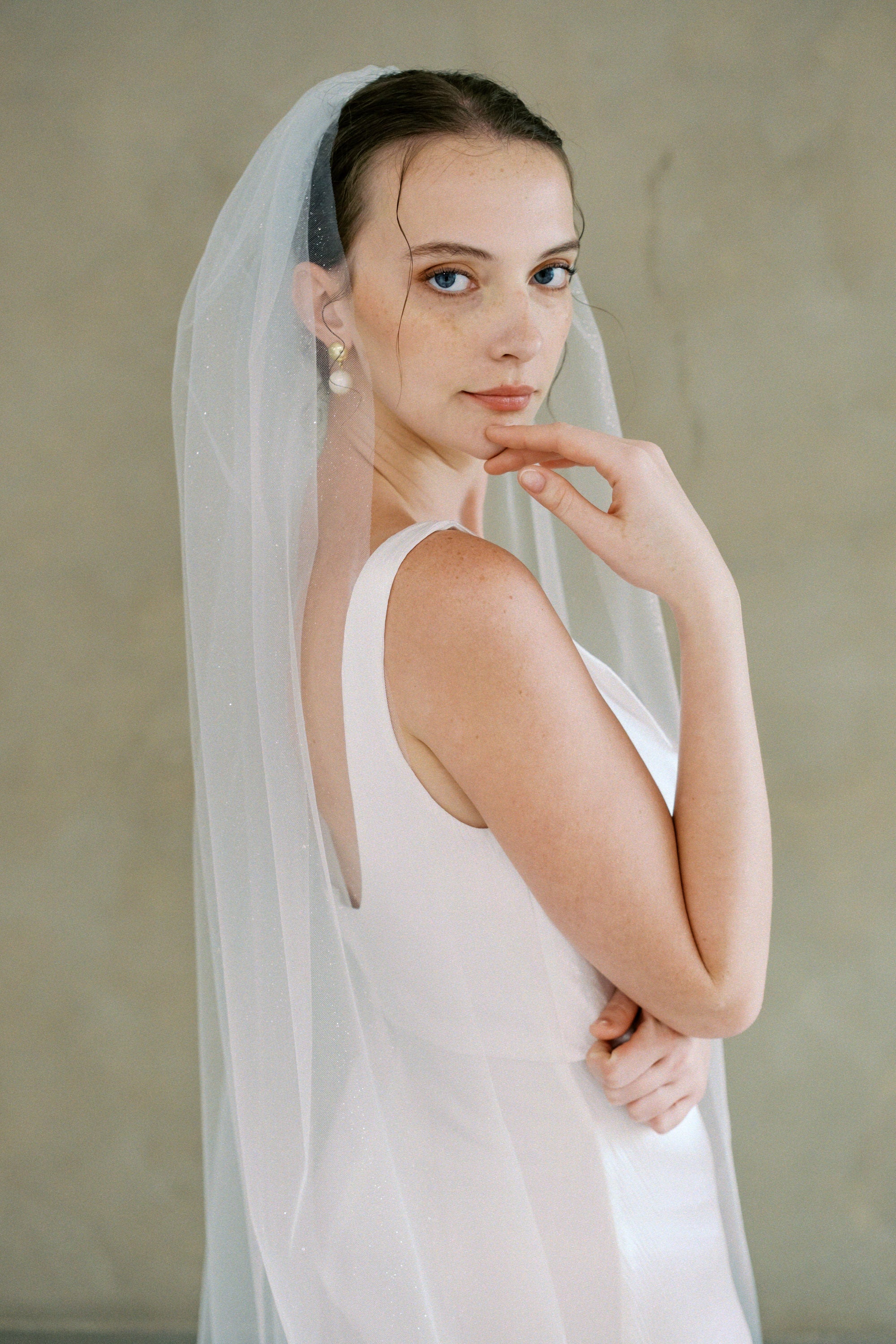 model wears a one-tier glitter veil 