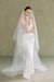 model wears a drop veil glitter wedding veil