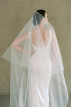 model wears a drop veil glitter wedding veil