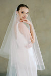 model wears a drop veil glitter wedding veil
