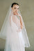 model wears a drop veil glitter wedding veil