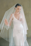 model wears a drop veil glitter wedding veil