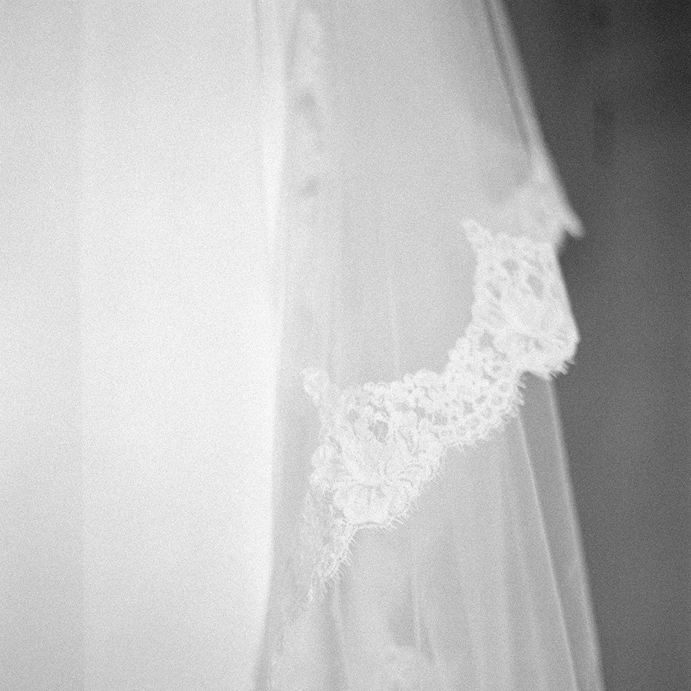 Soft focus closeup of lace trim of bridal veil by Madame Tulle Sydney