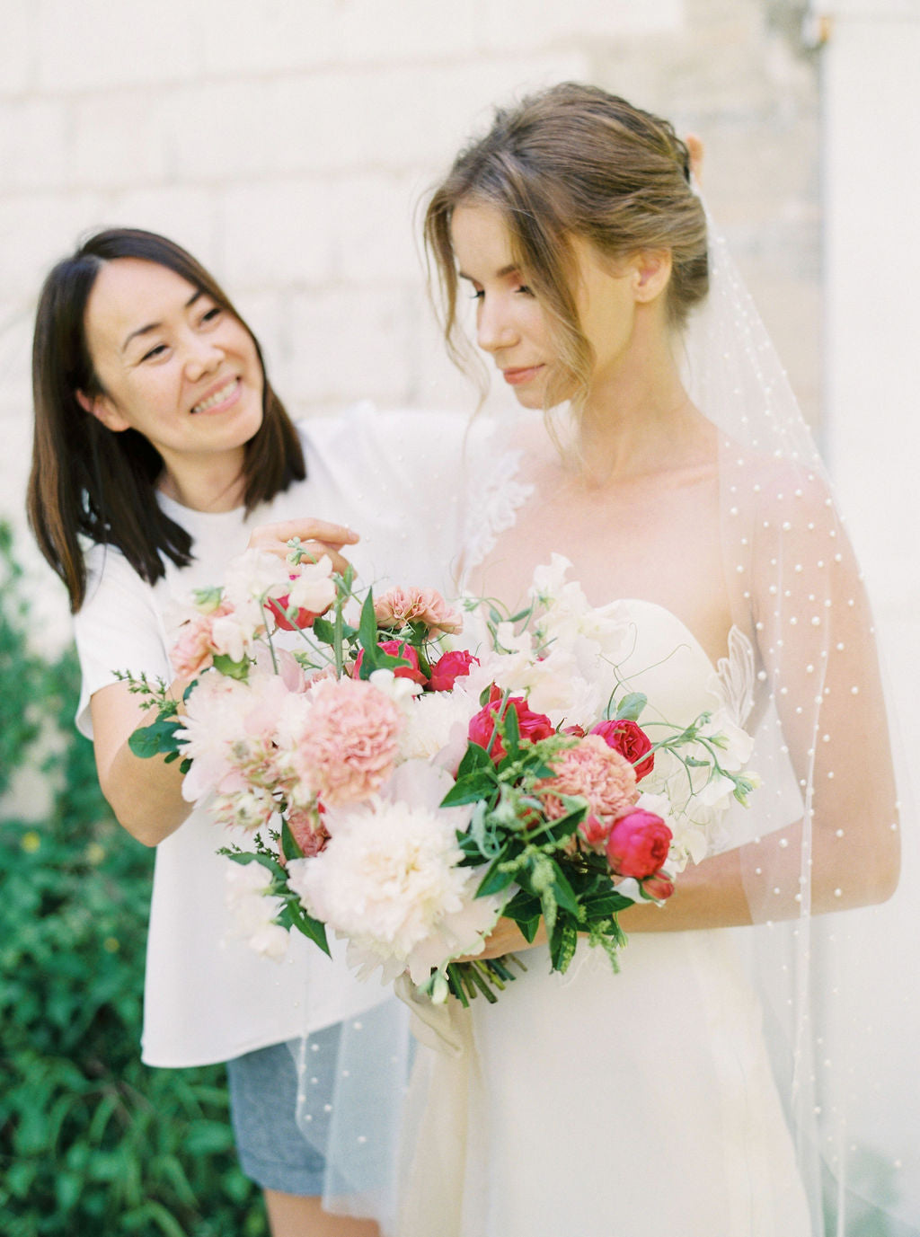 kay Kamara Debono a wedding veil designer putting a veil on a model at Madame Tulle photoshoot