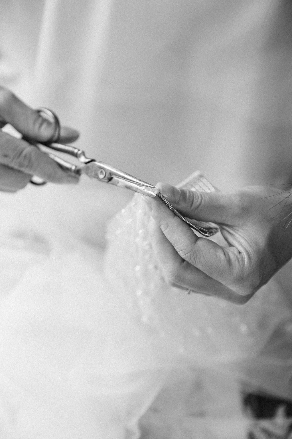 Madame Tulle branding shot of comb being affixed to bridal veil