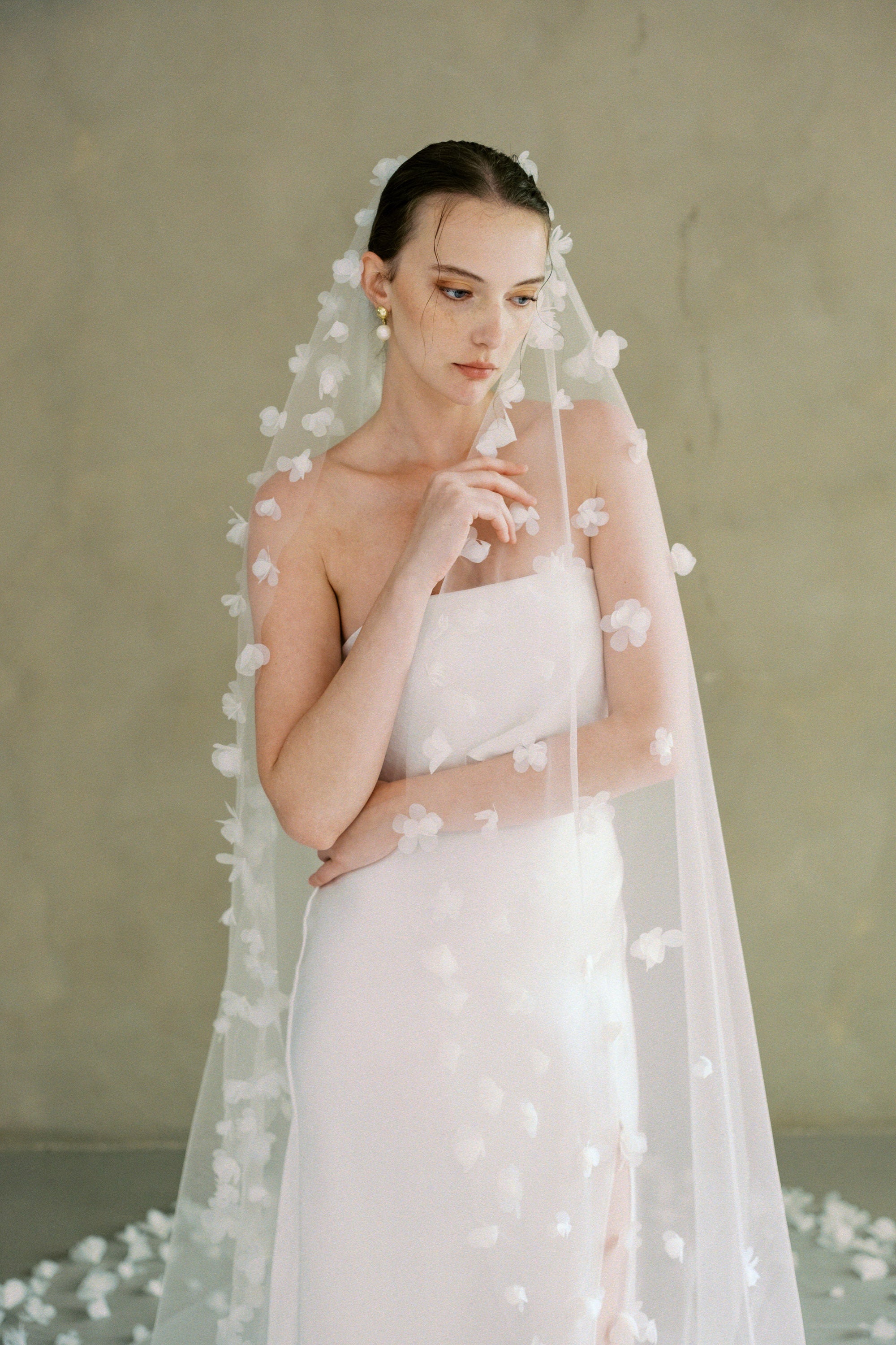 Model wears a 3D floral wedding veils made by Madame Tulle bridal