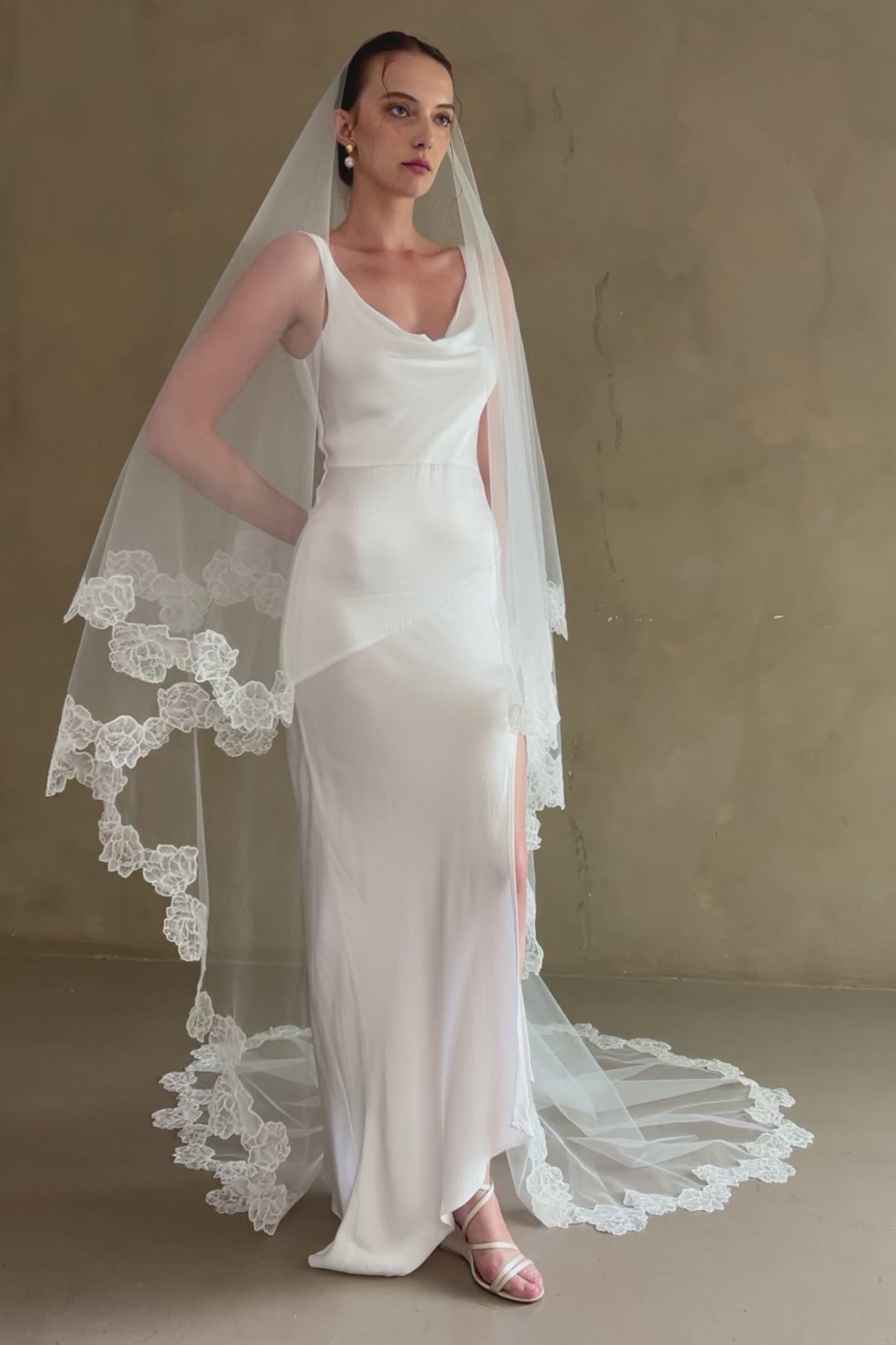 model wears two-tier lace trim veil, drop wedding veil