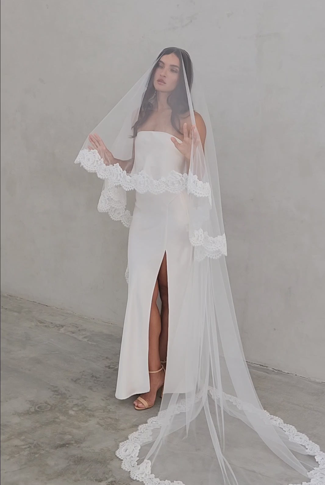 model wears mantilla veil, drop lace trim wedding veil