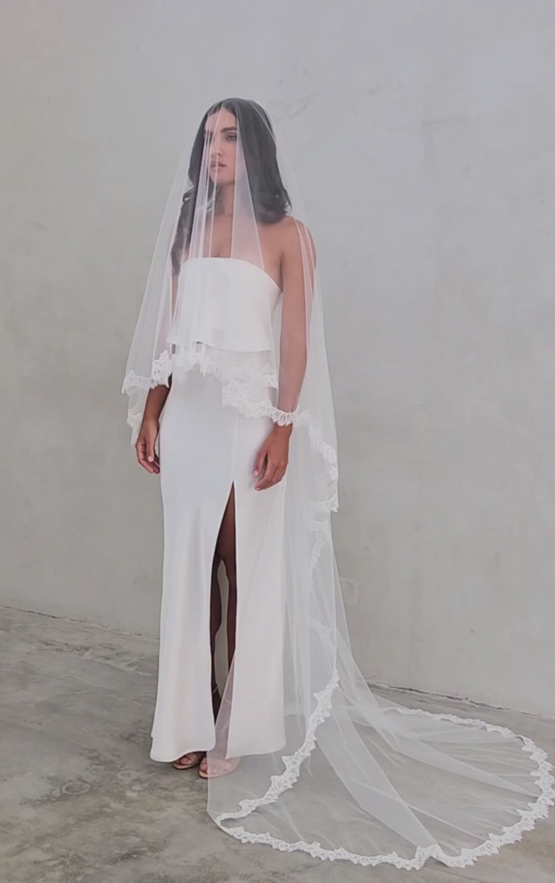 model wears mantilla veil, drop veil with lace trim