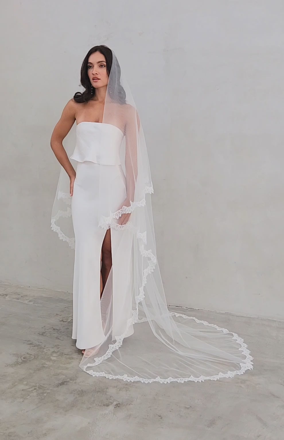 model wears mantilla veil, drop veil with lace trim