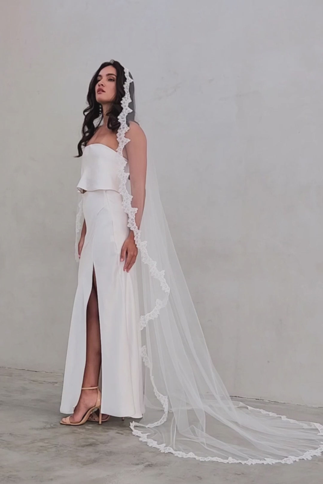 model wears mantilla veil, single-tier wedding veil with lace trim