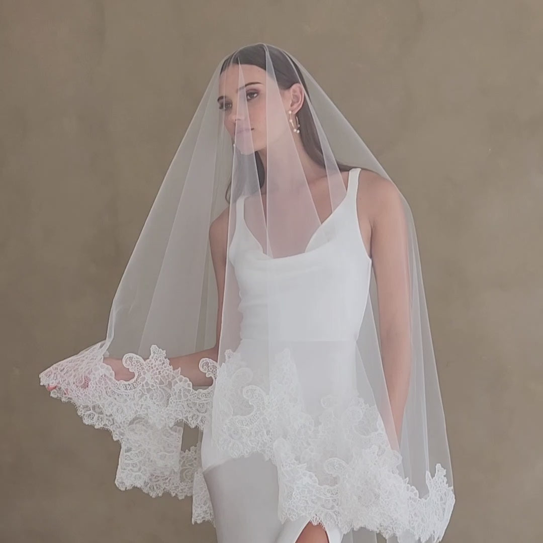 Short video showing bride modelling lace edged drop veil